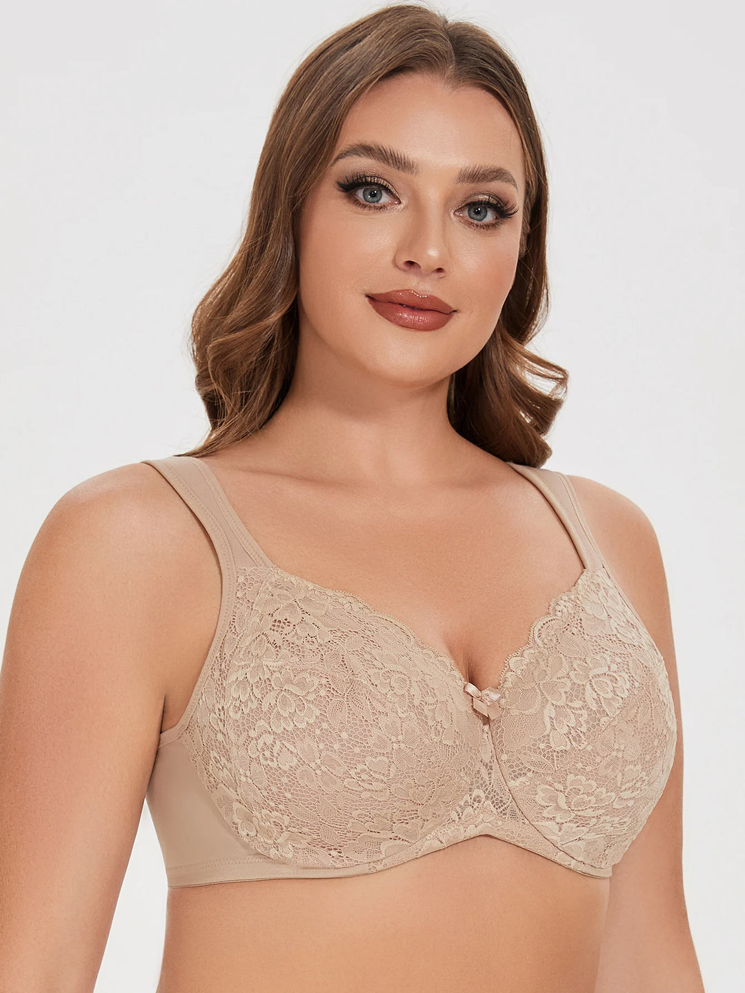 Beige lace underwire bra front view with lace overlay and center bow