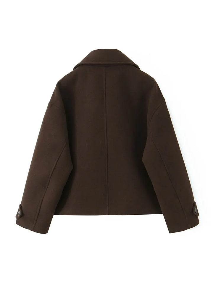 Women’s short overcoat, back view with structured shoulders and long sleeves