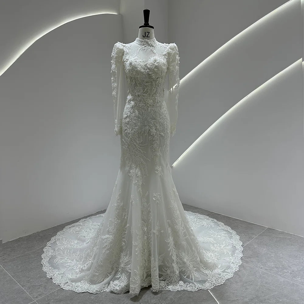 Ivory lace bridal gown with puff sleeves, fitted bodice, and full lace tulle skirt