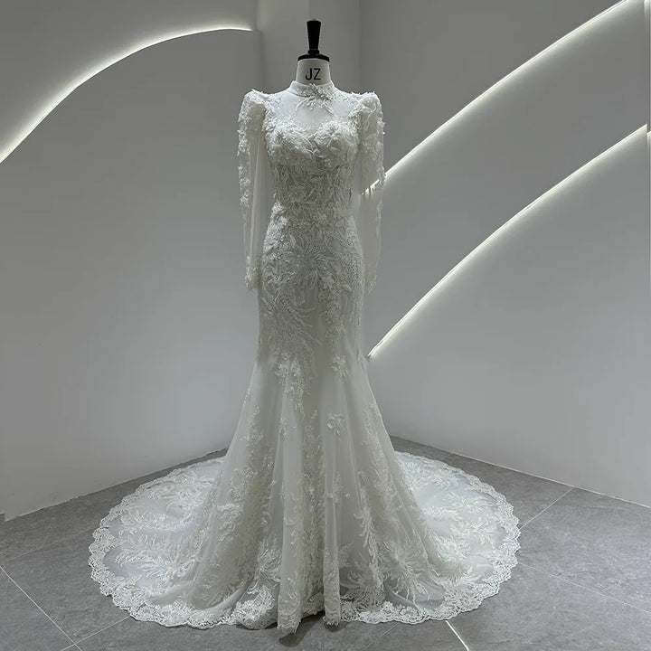 Ivory lace bridal gown with puff sleeves, fitted bodice, and full lace tulle skirt