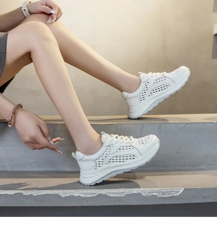 White lace-up woven mesh sneakers with perforated side panels and cushioned outsole.