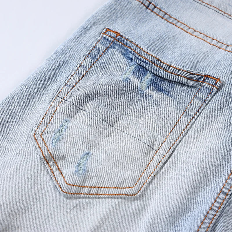 Trendy Perforated Patch Slim Jeans Pants