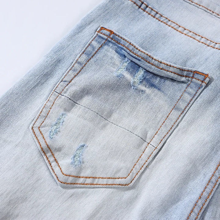 Trendy Perforated Patch Slim Jeans Pants