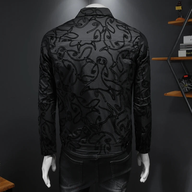 Black bomber jacket back view with all-over patterned flocking and ribbed hem cuffs