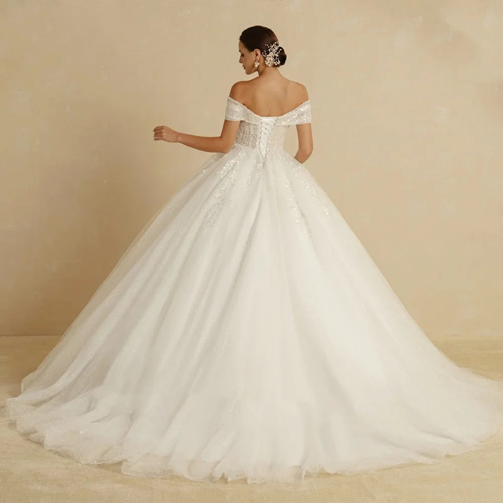 White wedding dress with lace details on a beige background