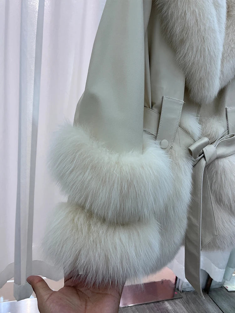 Beige leather coat sleeve and fur cuff with belt and flared faux fur hem.