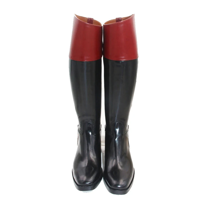 Pair of knee-high riding boots, red upper and black lower, glossy leather.