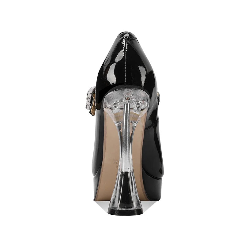 Black patent platform heel pumps with ankle strap and transparent geometric heel