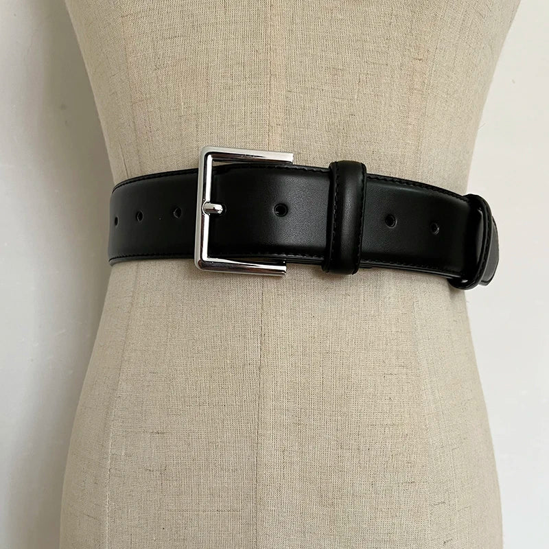 Black wide leather corset belt with rectangular buckle and punched adjustment holes
