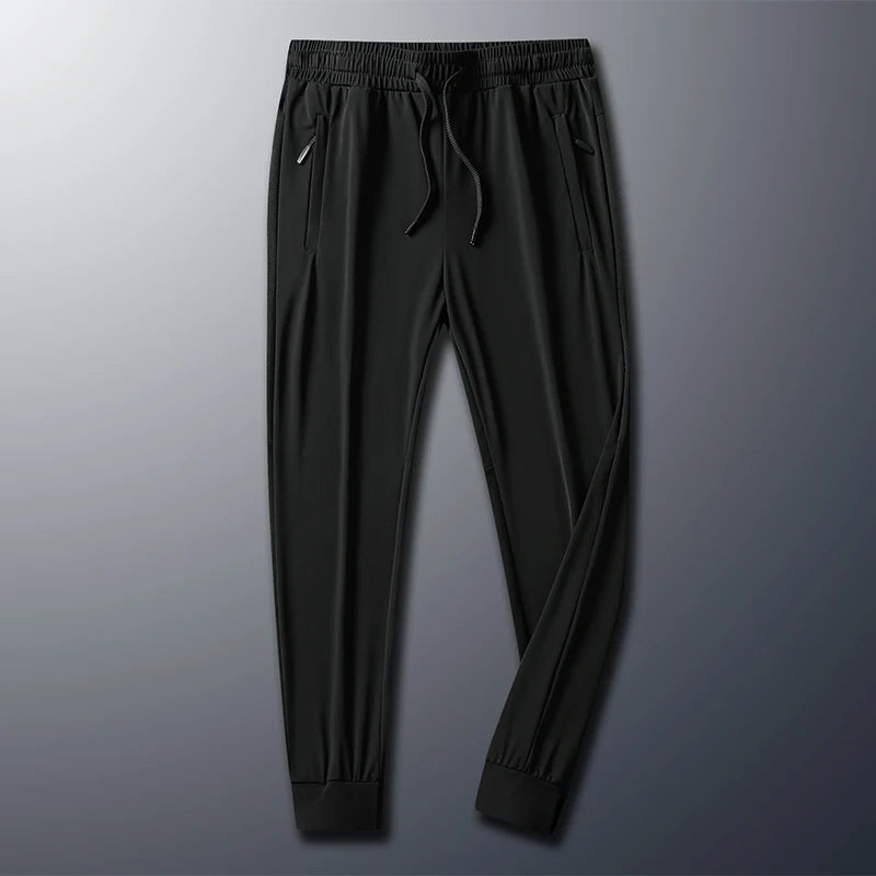 Men's high-stretch trousers, black, drawstring elastic waist and tapered legs