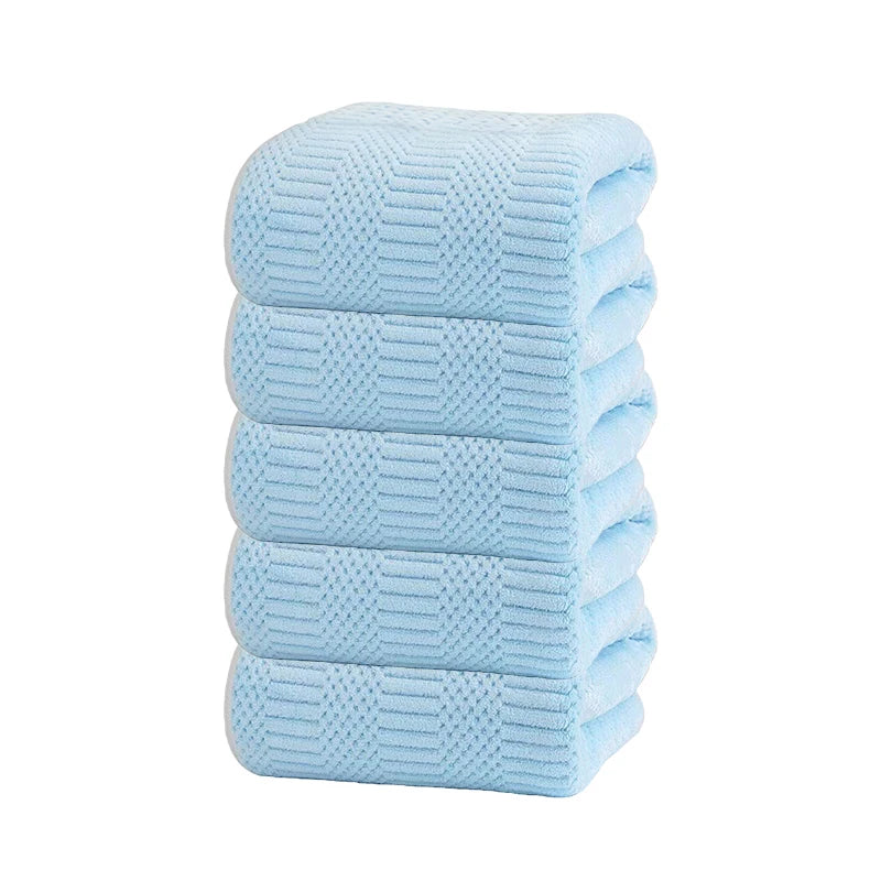 Light blue microfiber towel set with grid texture, neatly stacked