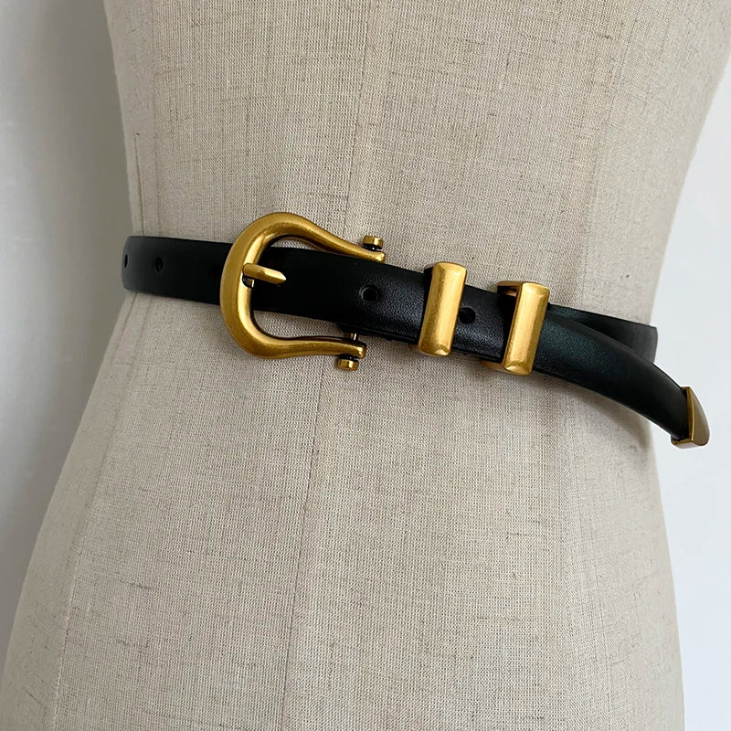 Black narrow leather corset belt with gold-tone oval buckle and two rectangular tabs