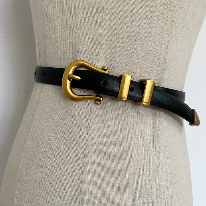 Black narrow leather corset belt with gold-tone oval buckle and two rectangular tabs