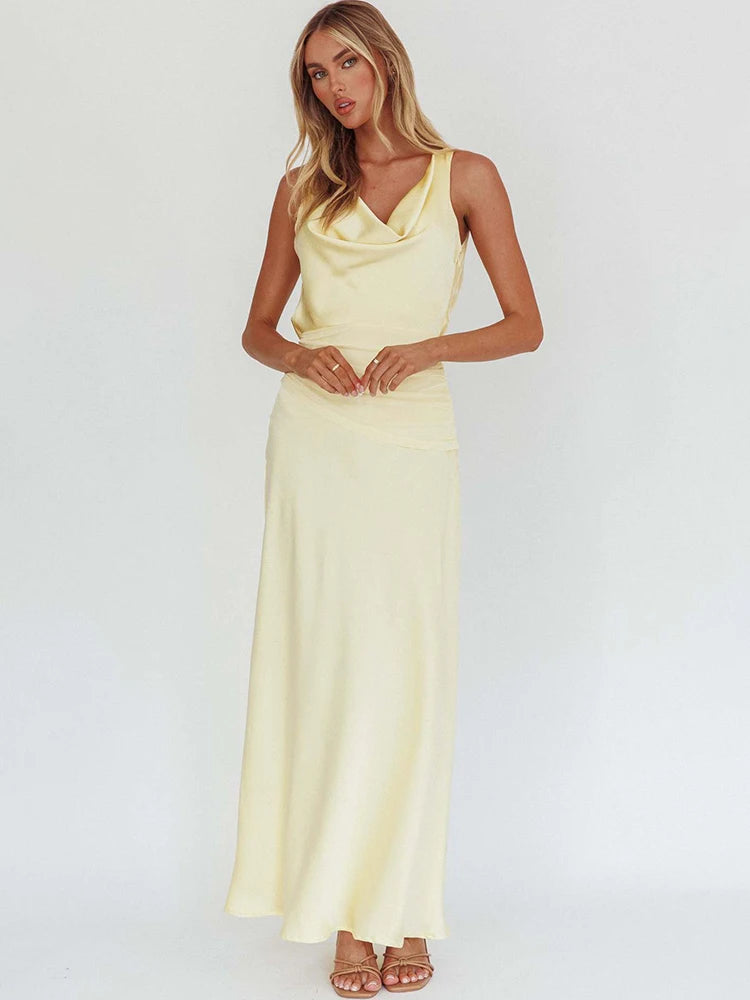 Light yellow satin maxi dress with cowl neckline and sleeveless fitted column silhouette