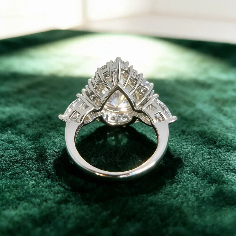 Pear-cut diamond ring side profile with open band and crown prongs