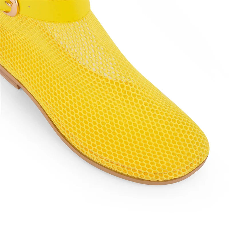 Yellow mesh boot toe with hollow pattern and brown sole edge