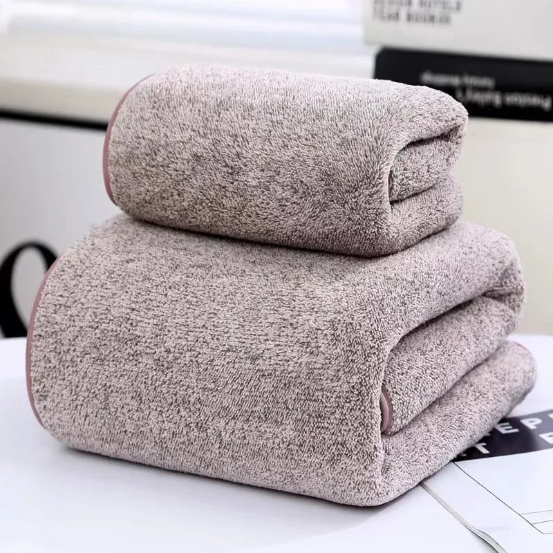 Light pink heather towel set, two folded towels stacked