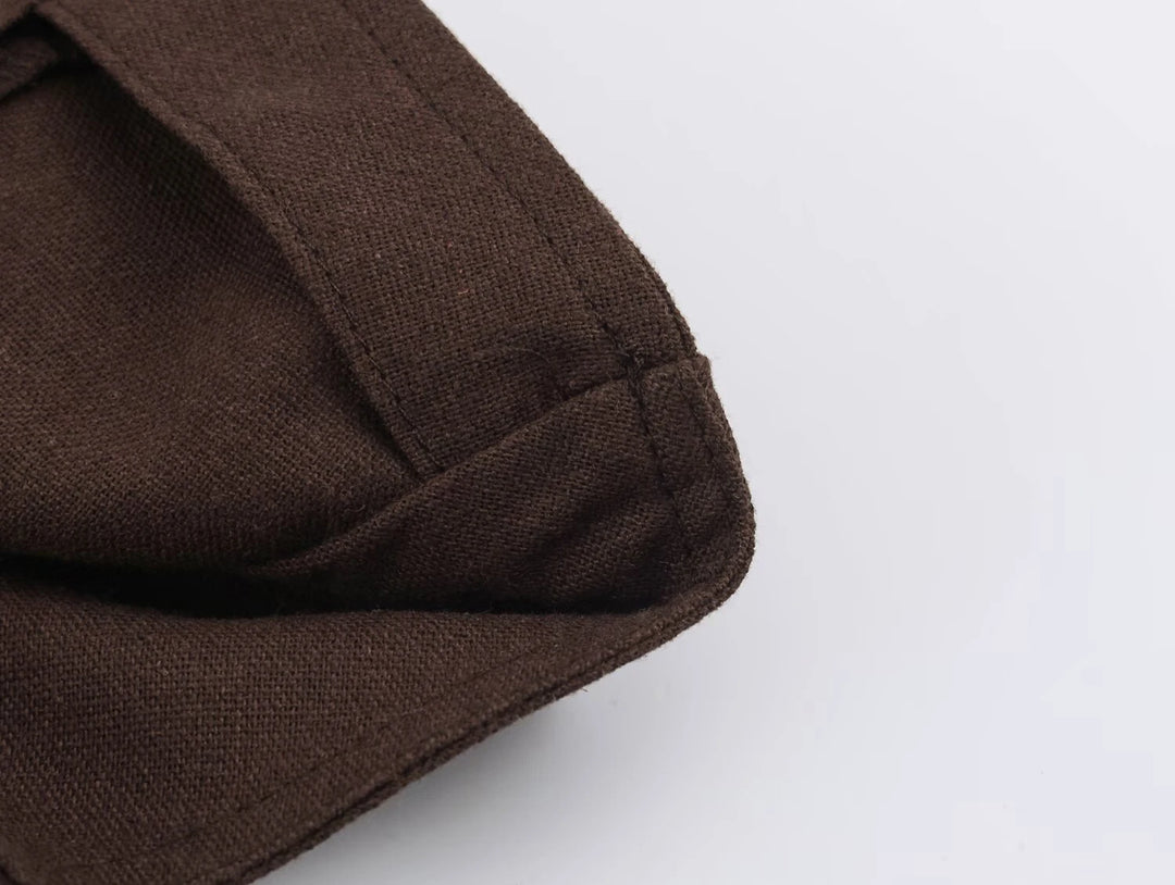 Dark brown coat hem with stitched edge and side seam