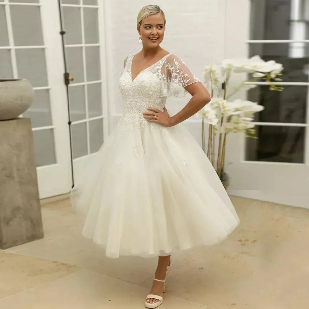 Ivory A-line bridal dress with lace illusion sleeves and sweetheart neckline