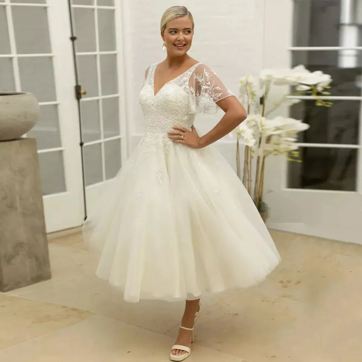 Ivory A-line bridal dress with lace illusion sleeves and sweetheart neckline