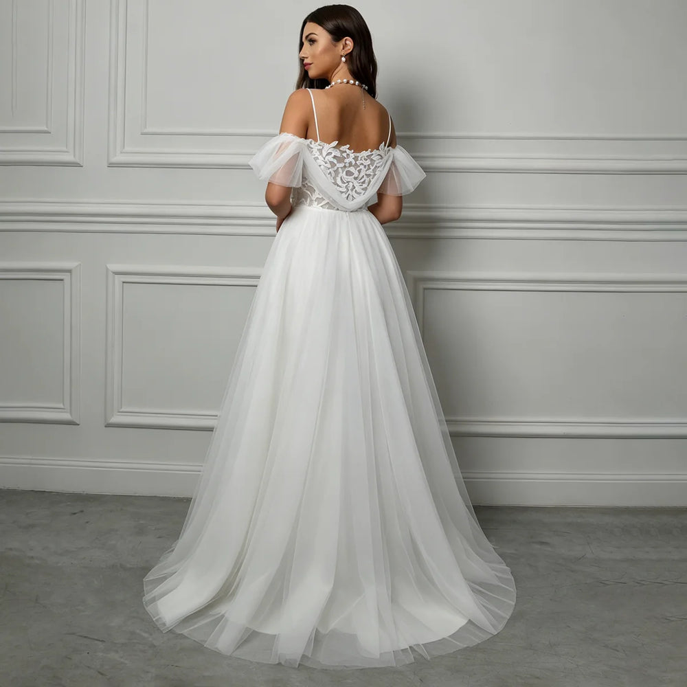 White A-line tulle bridal gown with lace back and off-shoulder sleeves