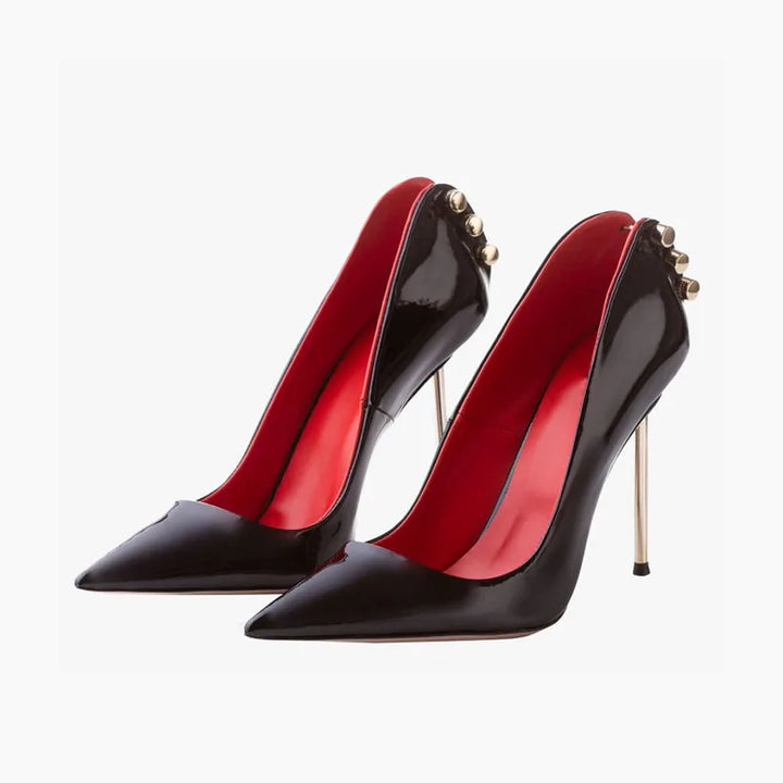 Pair of black pointed-toe leather heel pumps with red lining and gold stud details