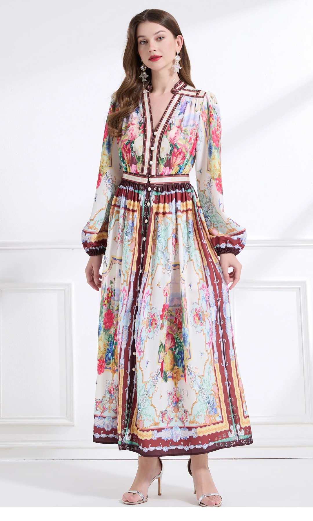 Woman wearing a colorful floral dress on a white background