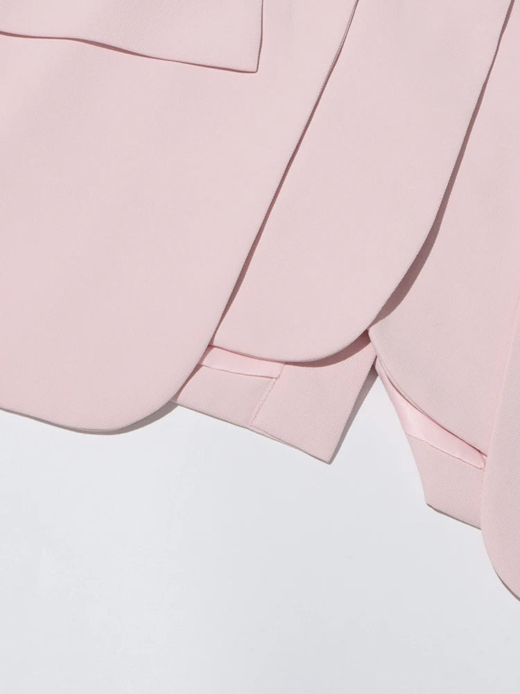 Pink slim blazer with cuff and sleeve opening, showing buttonless cuff construction