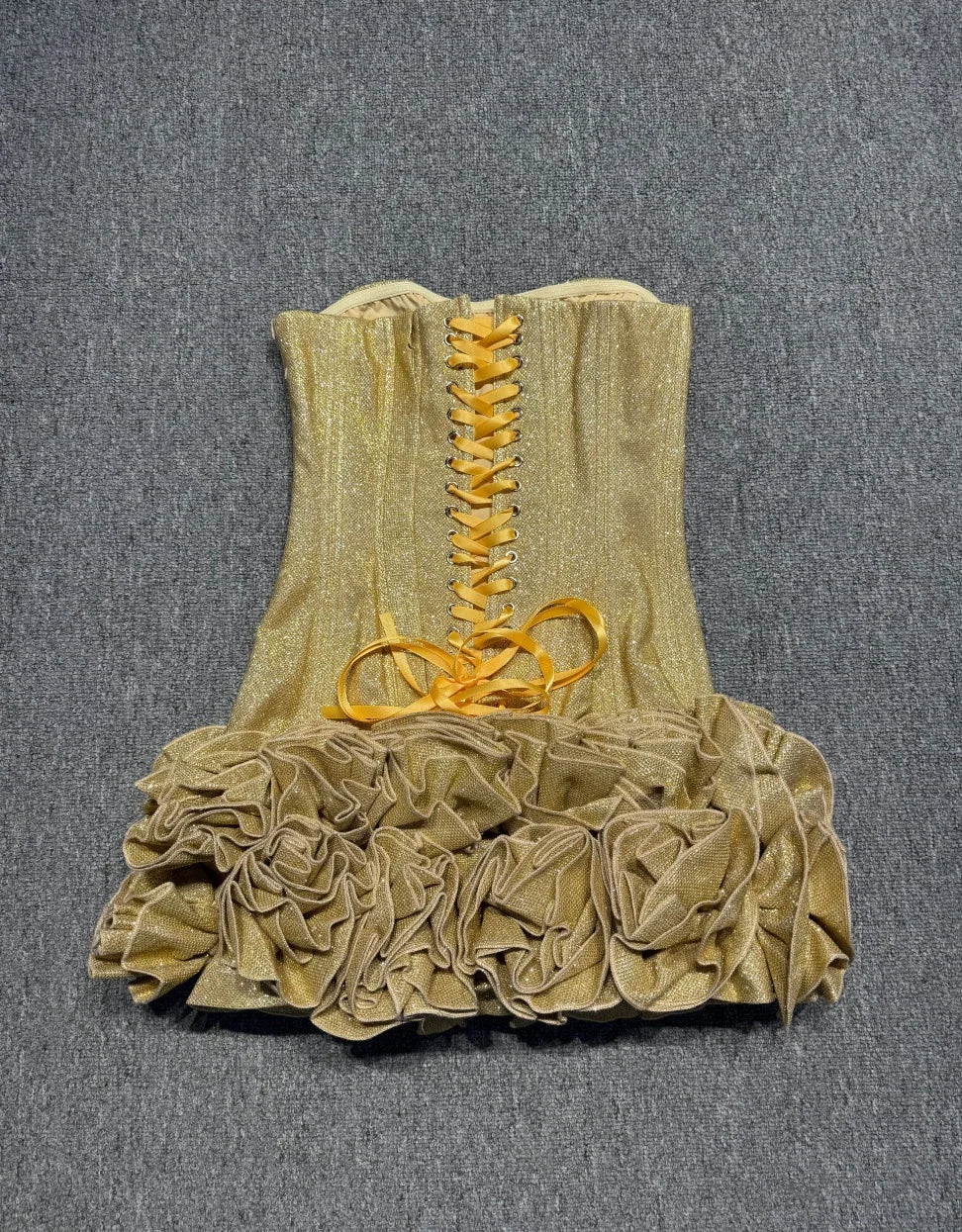 Gold mini dress with lace-up front and layered ruffle skirt
