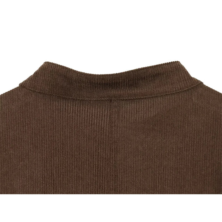 Brown cropped jacket with ribbed stand collar and button placket seam detail