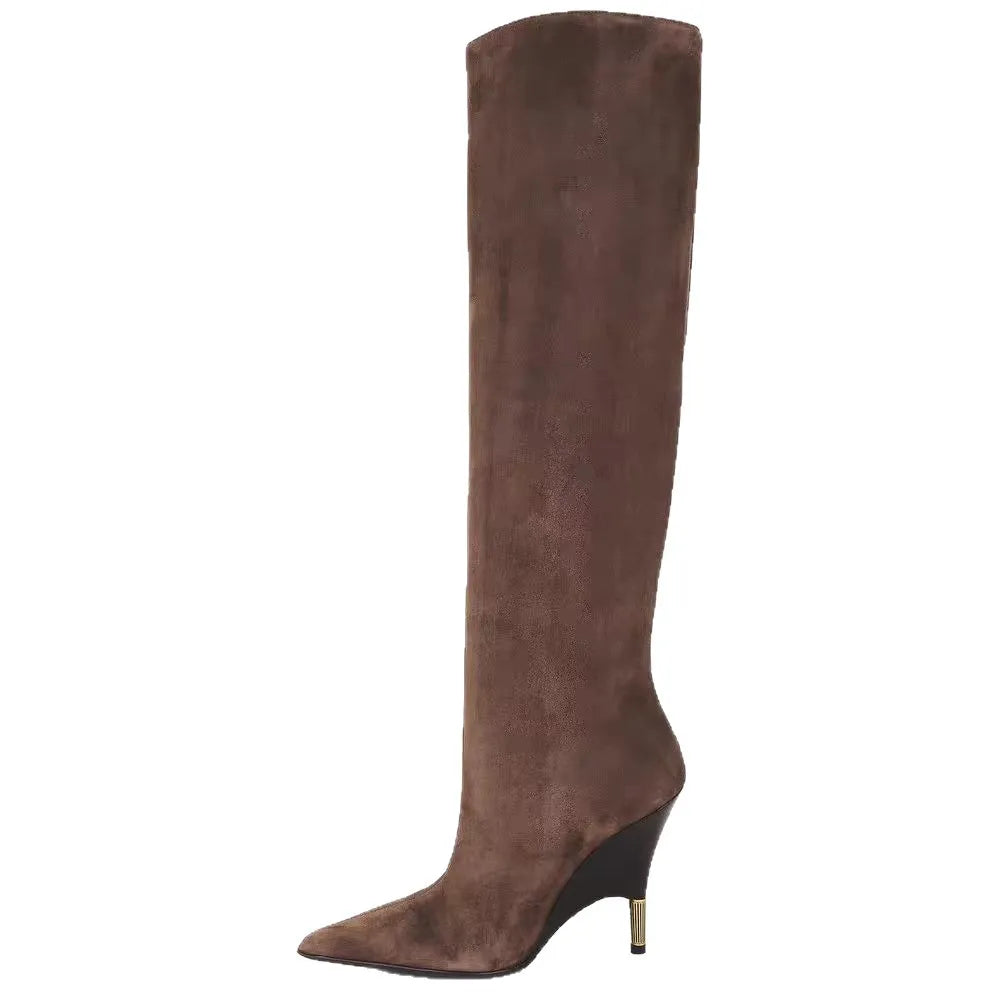 Brown faux suede knee-high boots, angled side view with pointed toe and heel
