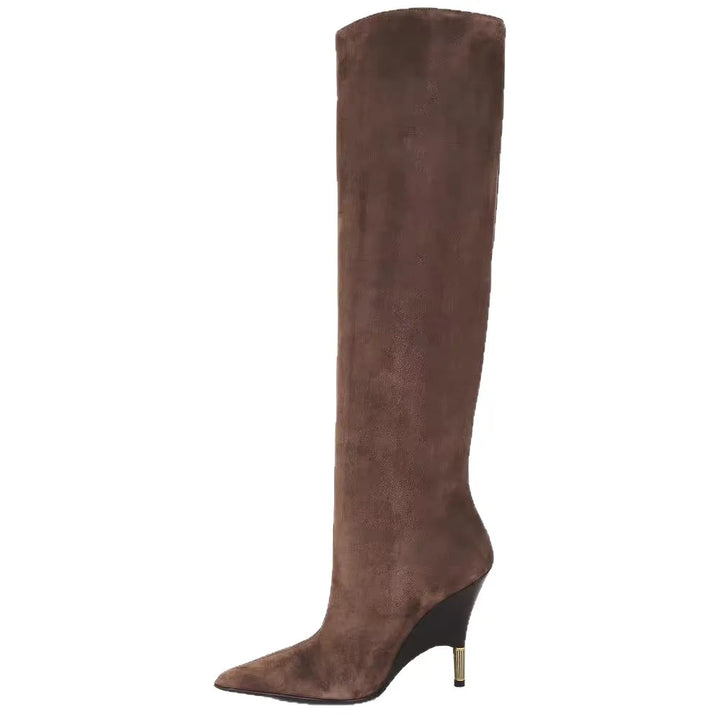 Brown faux suede knee-high boots, angled side view with pointed toe and heel