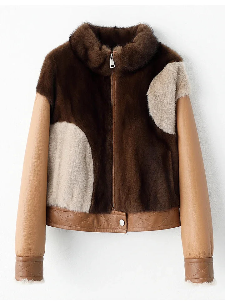 Women’s short mink fur jacket, close-up front, brown and tan panels with zip and belt