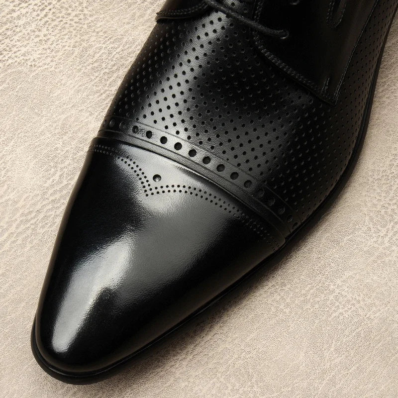 Black leather lace-up dress shoe with perforated vamp and smooth toe cap