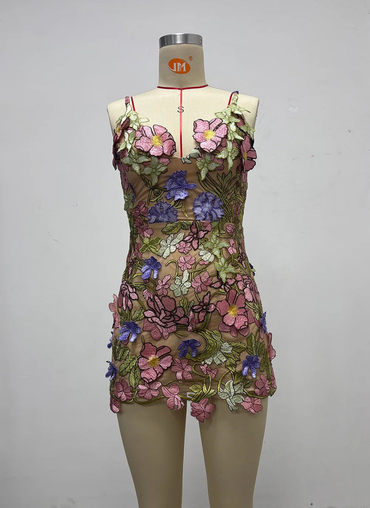 Pink floral embroidered mini gown with spaghetti straps and scalloped hem