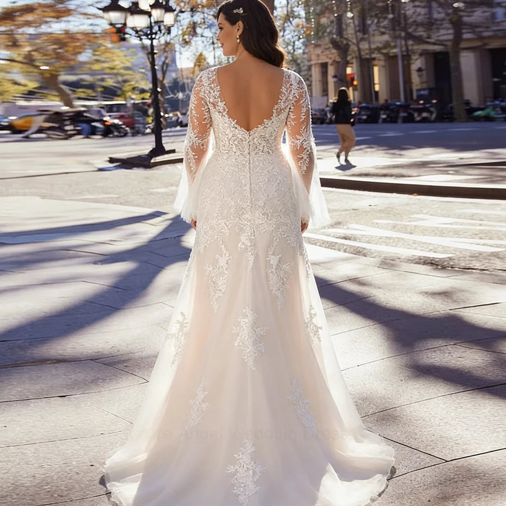 Ivory mermaid wedding dress with lace illusion open back and sheer long sleeves