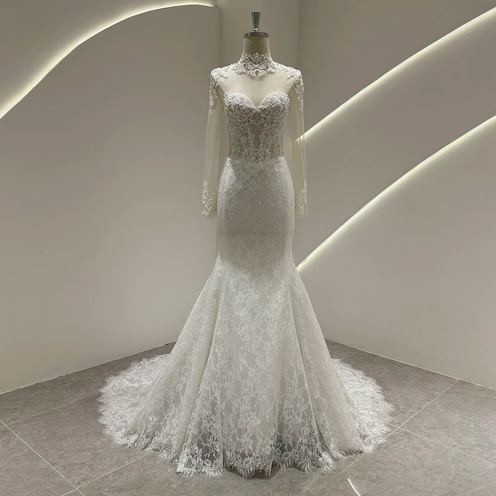 Ivory lace mermaid wedding gown with illusion lace neckline and fitted bodice, long train