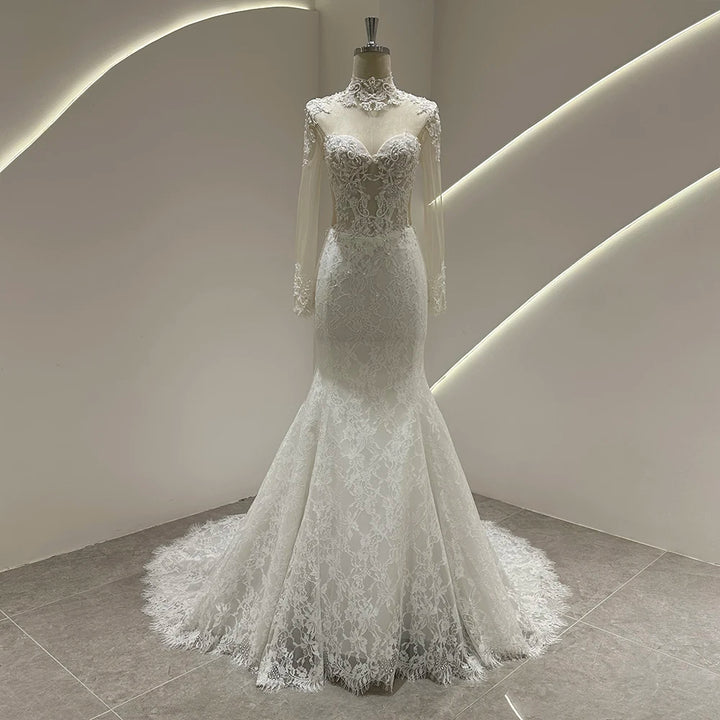 Ivory lace mermaid wedding gown with illusion lace neckline and fitted bodice, long train