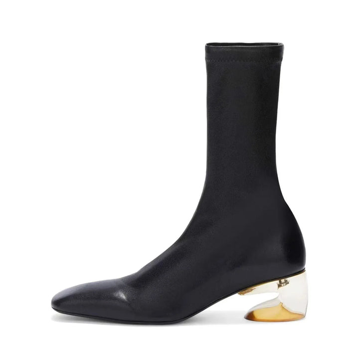 Black square-toe ankle boot with mid block heel, side view and gold-toned base