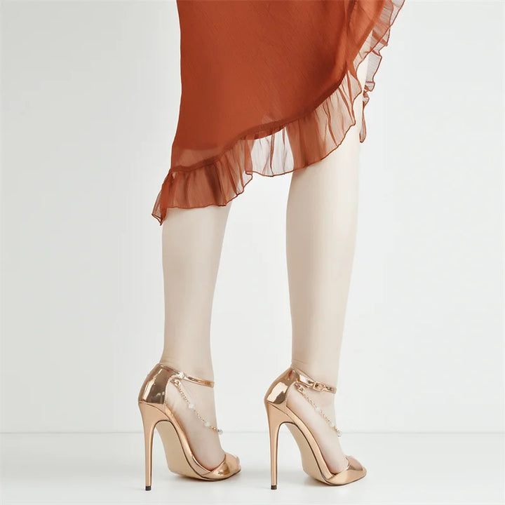 Metallic gold open-toe stiletto heel sandals with pearl-bead chain ankle straps
