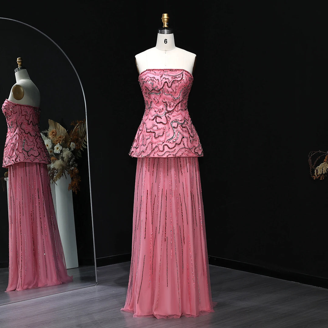 Pink evening gown on a mannequin against a black background