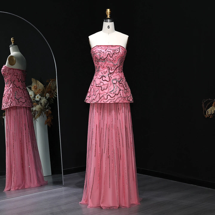 Pink evening gown on a mannequin against a black background