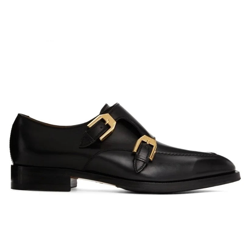 Black leather shoe with gold buckles on a white background, branded 'Stiglitz'.
