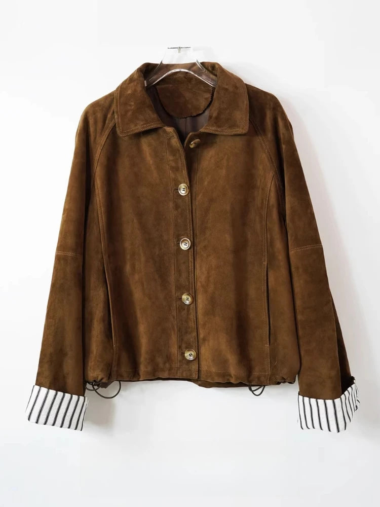 Brown suede women's loose coat jacket, front view on hanger; button placket and striped cuffs.