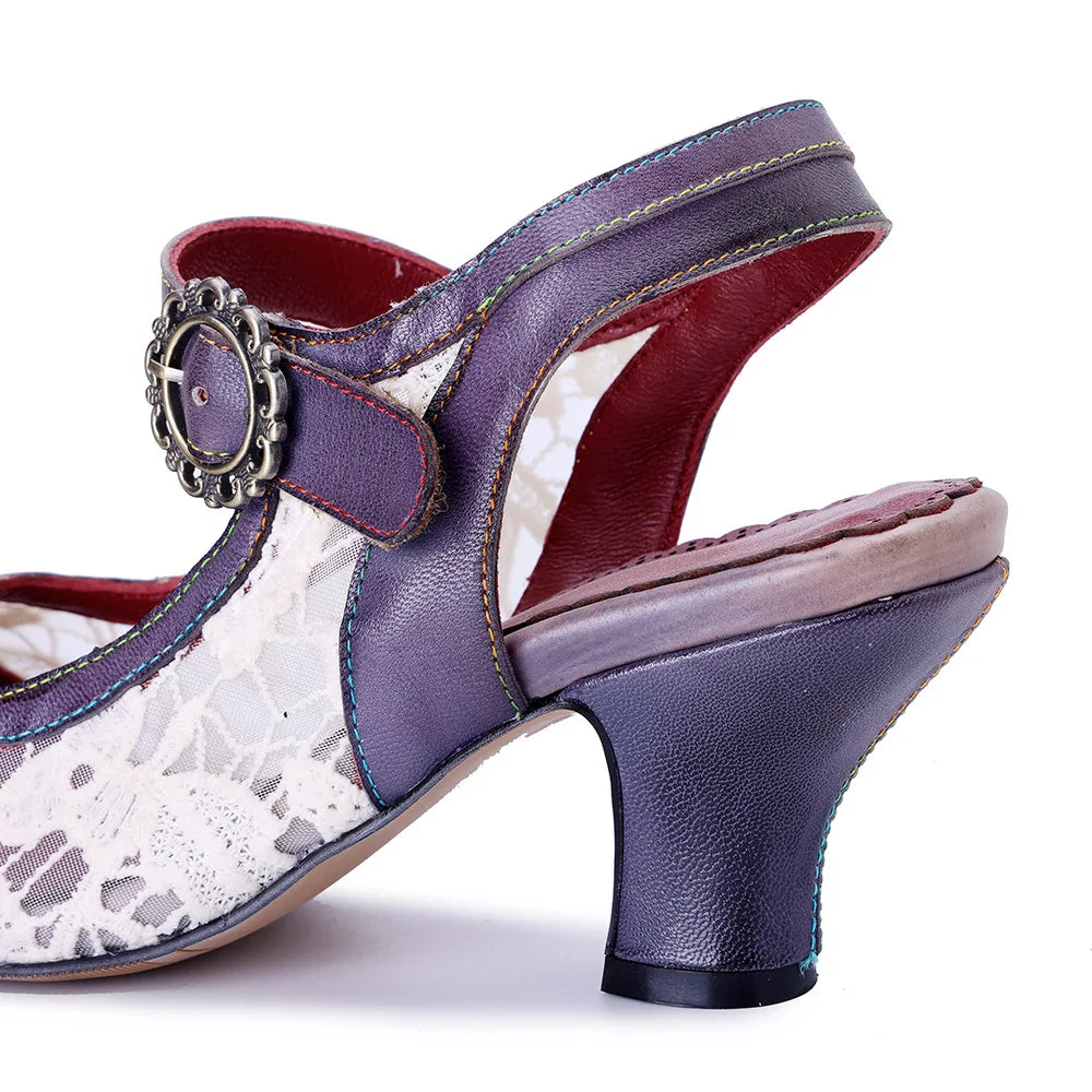 Women’s heeled slide-style sandal, side view with navy/purple heel, red lining, round buckle ornament