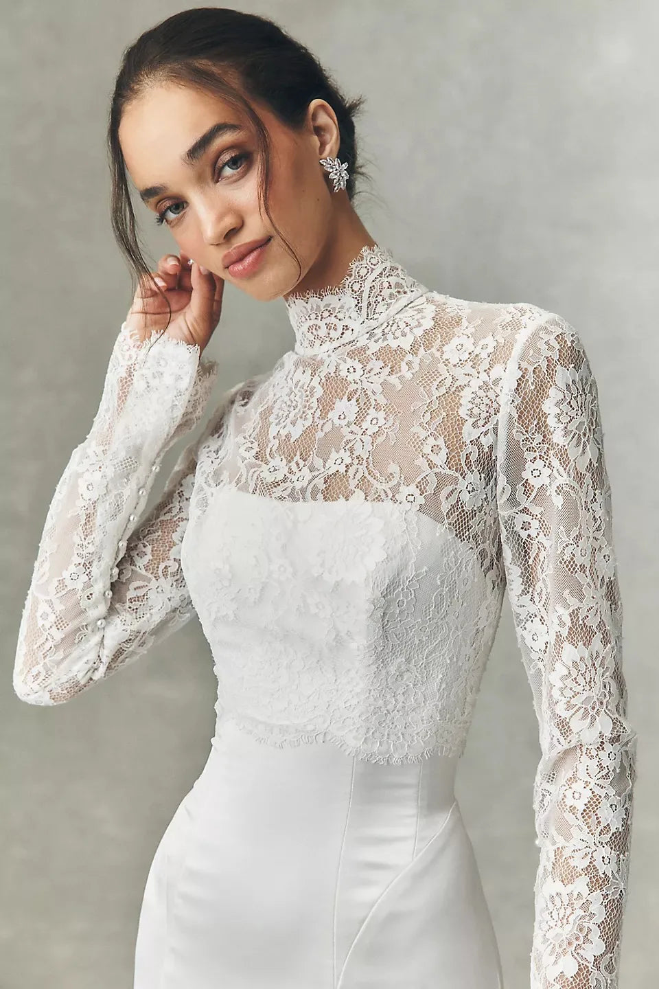 White lace high-neck bridal jacket with long sleeves and fitted bodice, front view
