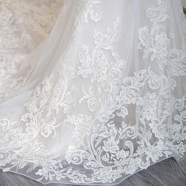 Ivory lace tulle skirt with ornate floral embroidery and scalloped hem