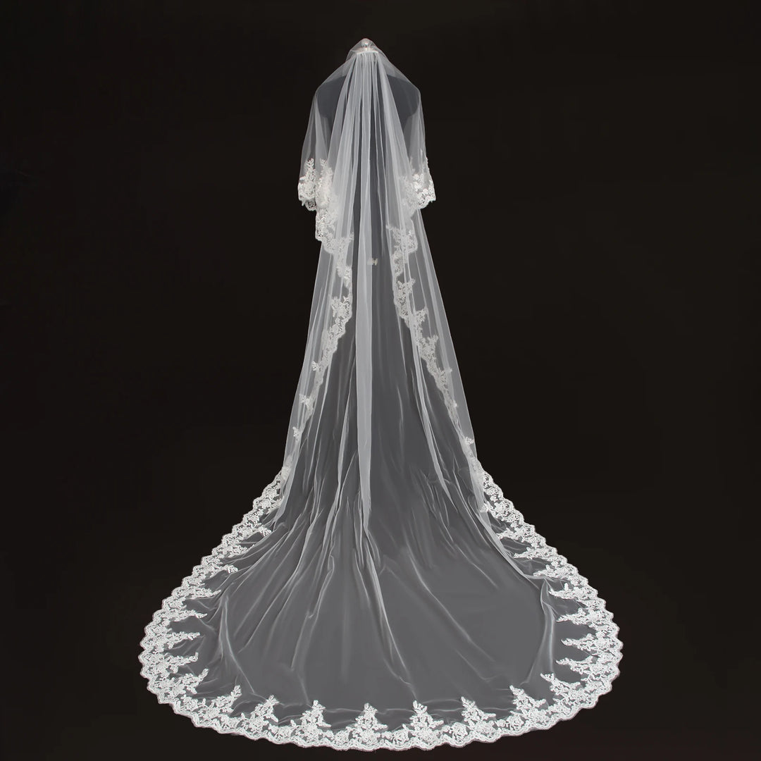 Long dark bridal veil with scalloped lace trim, full floor-length drape