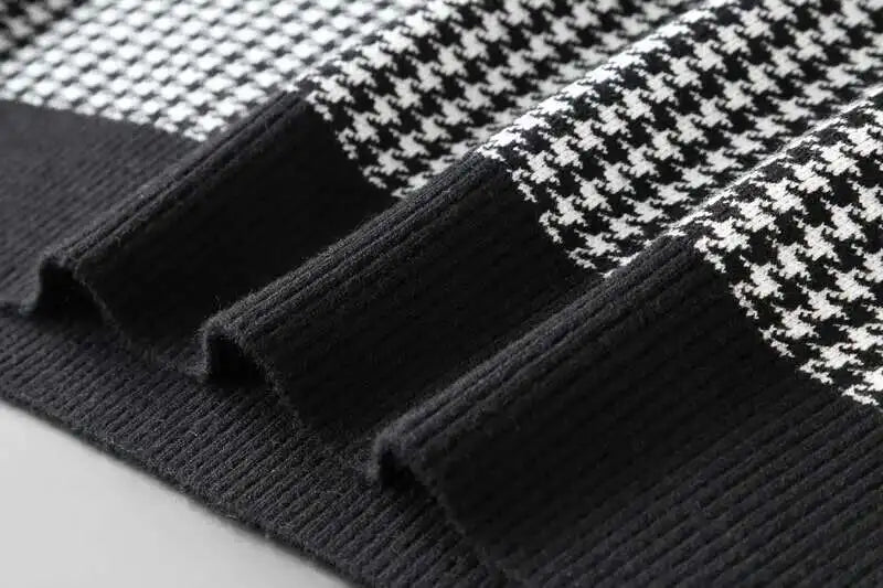 Ribbed black knit sleeve cuff on a black-and-white houndstooth T-shirt