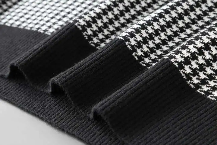 Ribbed black knit sleeve cuff on a black-and-white houndstooth T-shirt